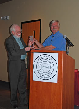 Dr. McCluskey receives award from Dr. Bostwick